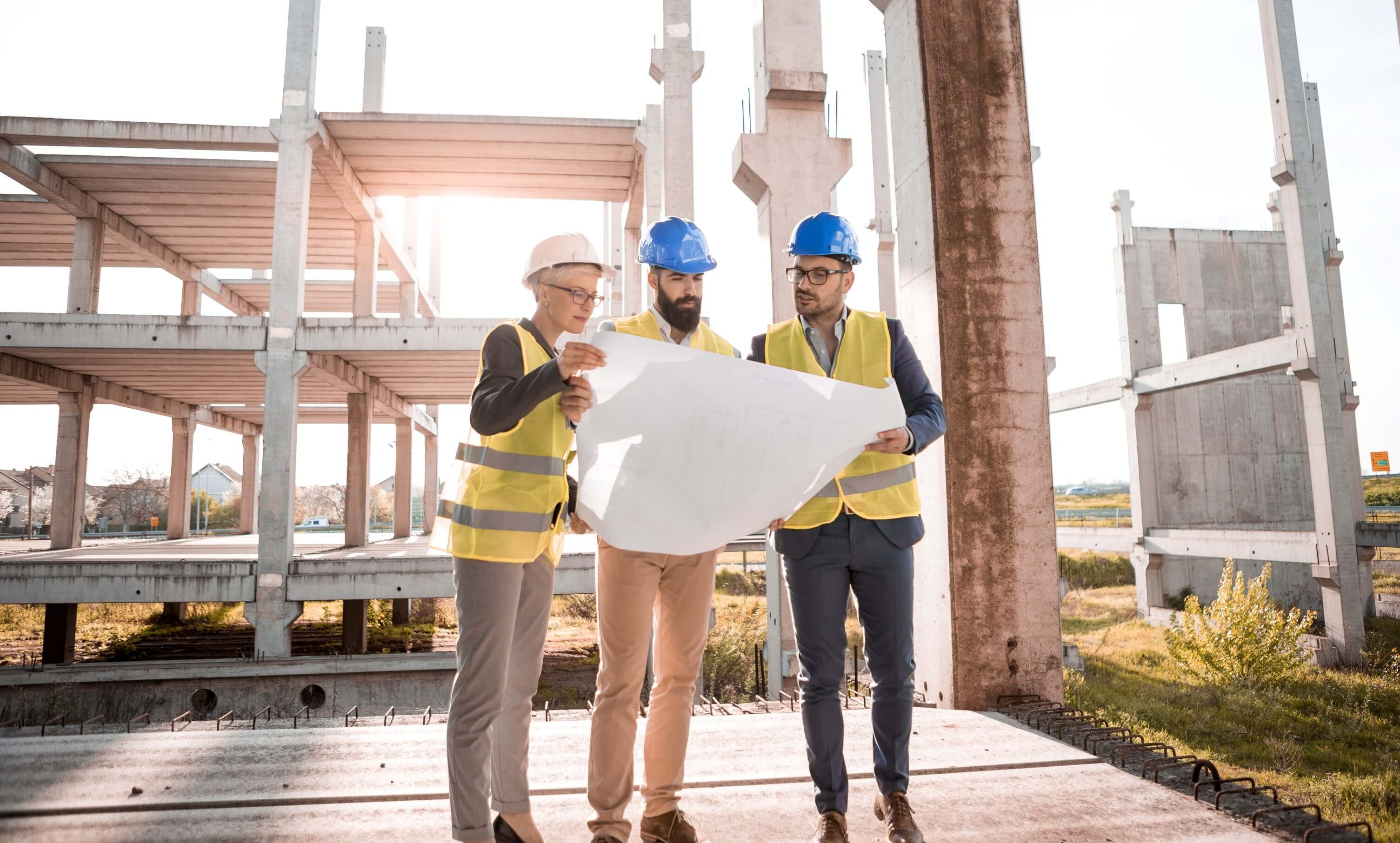 Senior construction masters looking at a construction planSenior construction masters looking at a construction plan